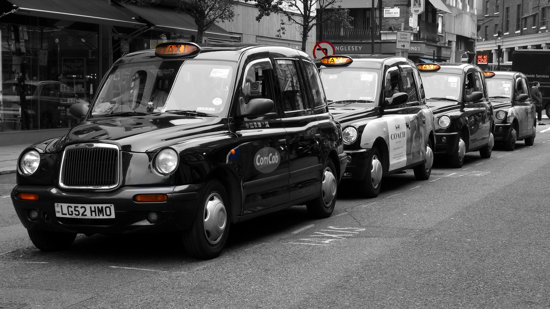 picture of a row of black london taxis